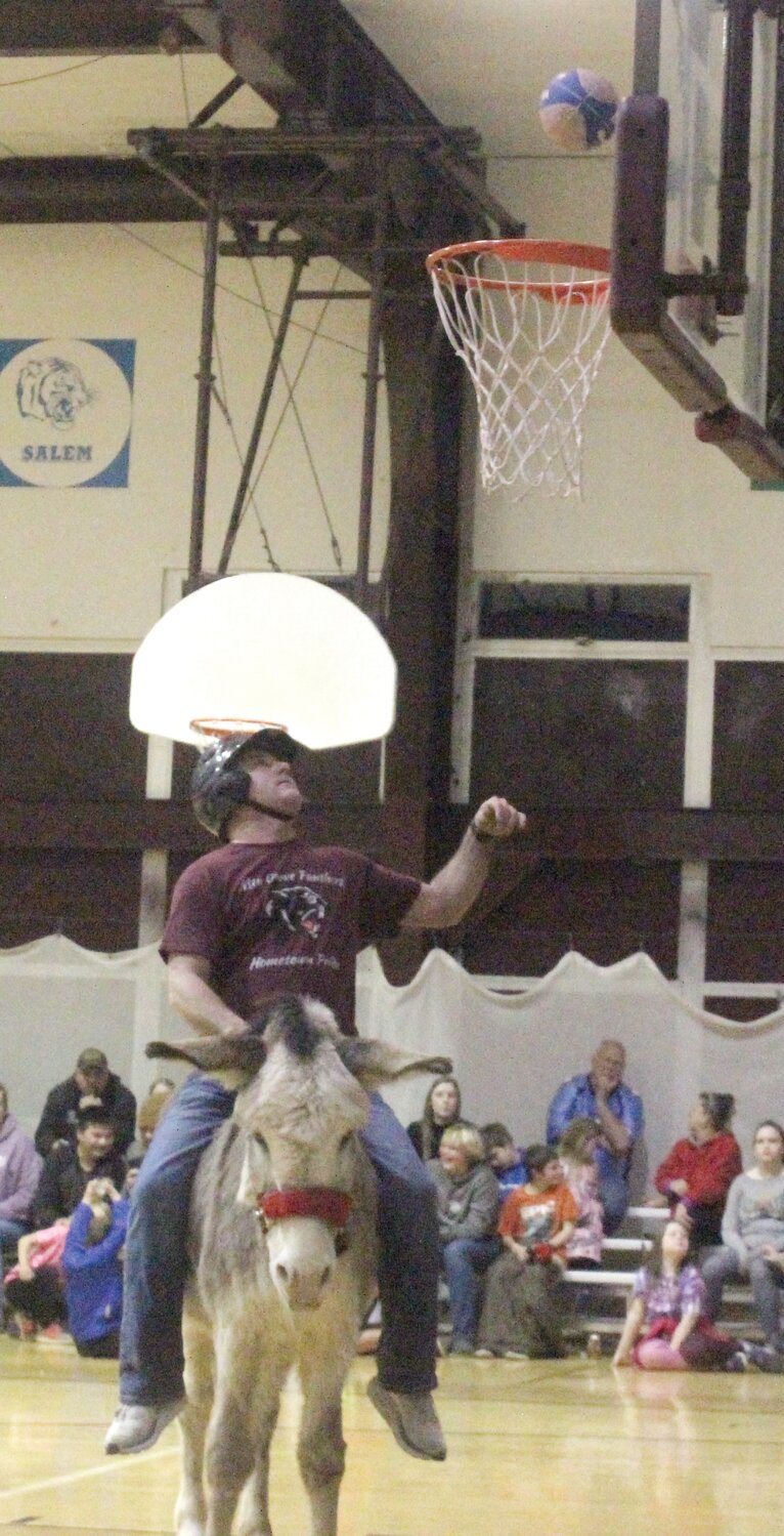 Mountain Grove Athletic Director Brandon Rodgers takes his shot in the lane while playing donkey basketball for his team, the “One Eye Jacks.”